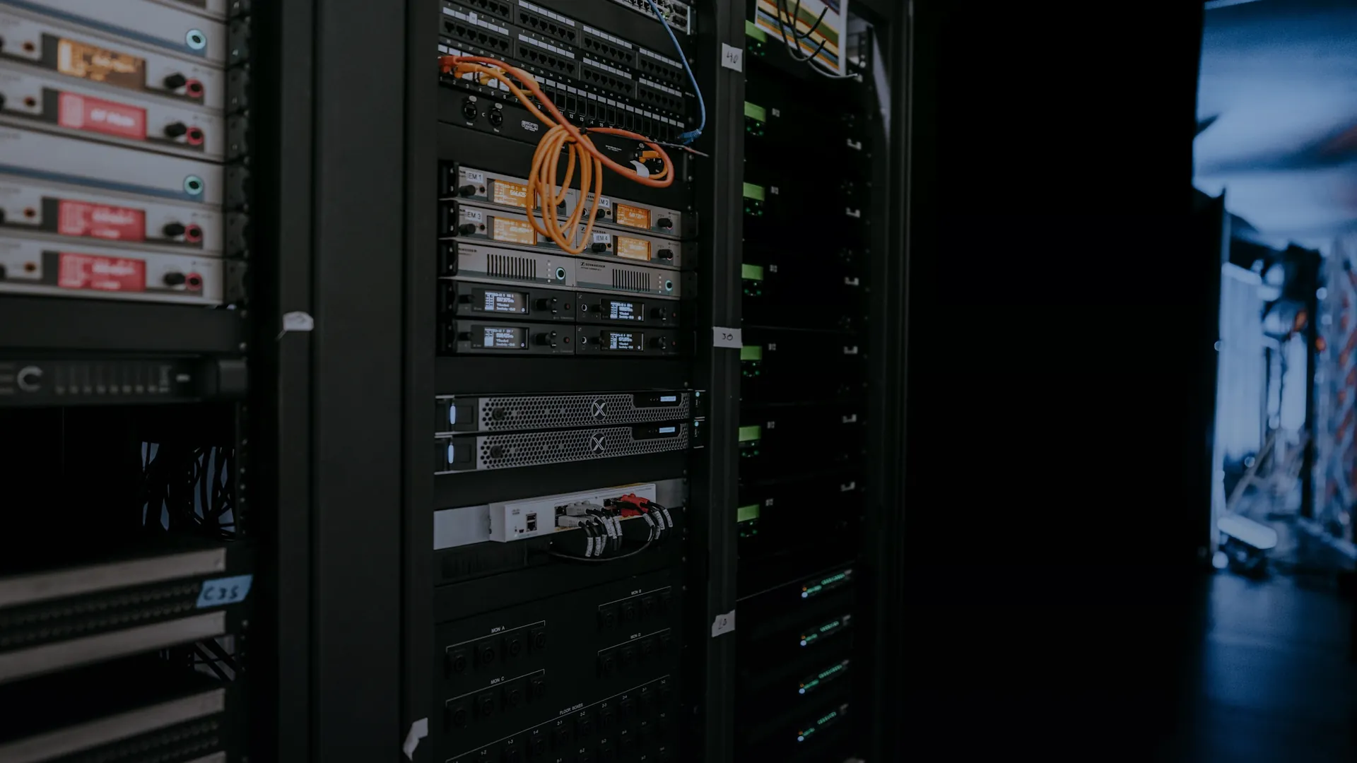 Ordered rows of computing infrastructure receding into depth, symbolizing the path from a working simulator toward production infrastructure.